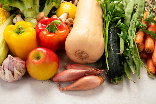 Different fresh vegetables as background.