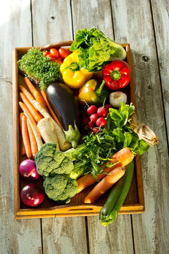 Wooden tray with different vegetables
