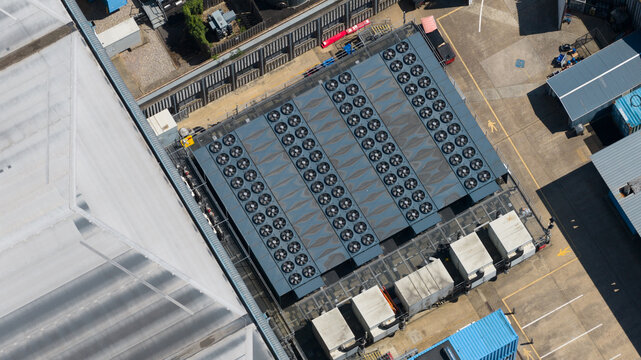 Aerial drone view shows a modern data center with cooling equipment