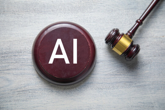 Judge wooden gavel with a AI word.