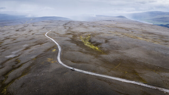 Off-road vehicle on winding Road 910 in remote Eastern Region of Iceland
