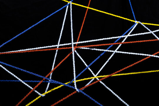 Connected threads in front of black background
