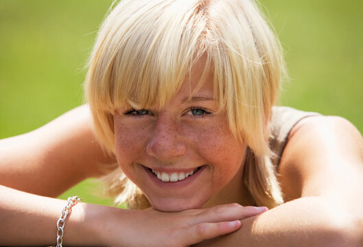 Teenage girl (13-15) smiling, portrait, close-up