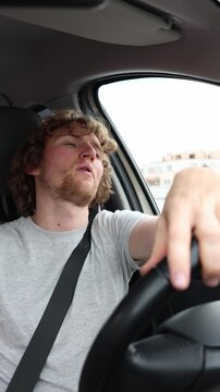 Vertical screen driver maintains a serious businesslike expression while enjoying the first journey in a newly purchased car with confidence pride and subtle satisfaction