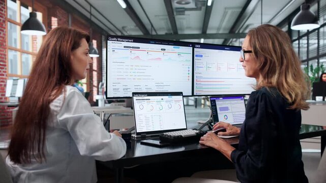 Woman Manager Uses Laptop To Track Quality Actions