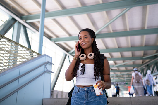 Young African American woman talking on phone