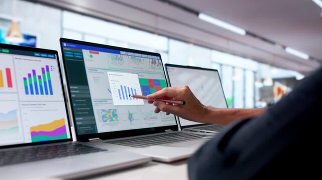 Mature Woman Studies Financial Data On Her Laptop