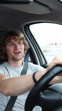 Vertical screen driver looks shocked by other motorists expressing confusion and helplessness about current traffic rules while continuing to navigate a crowded urban road
