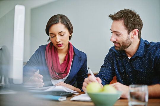 Creative, people and document in office with computer, research and preparing for press release. Team, reading or paperwork in workplace with pc, proofreading and interview notes for story manuscript