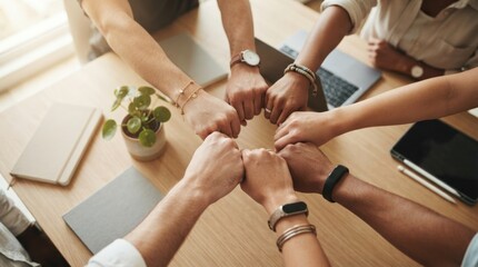 Obraz premium Professional team forming a handshake circle in a modern office setting, ideal for corporate marketing, team-building content, and motivational business presentations.
