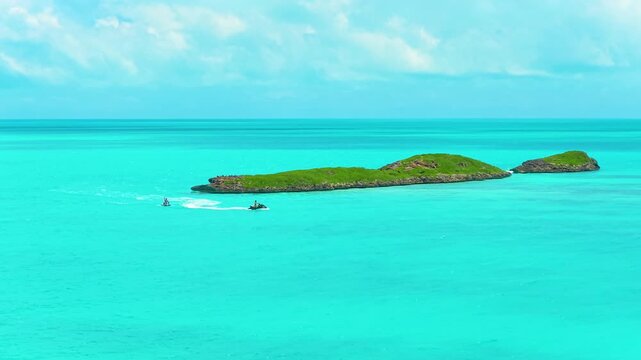An aerial clip captured in 4k of a couple of jet ski's exploring the Caicos banks