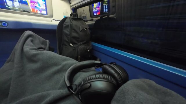 Traveling overnight on a sleeper bus with the window open, capturing passing nighttime scenery and the atmosphere of long-distance travel in Southeast Asia.