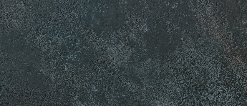 Dark gray concrete wall texture background with rough mottled surface pattern