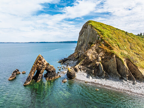 Blackchurch Rock and Cliffs over Mouthmill Beach from a drone, North Devon Coast, Devon, England