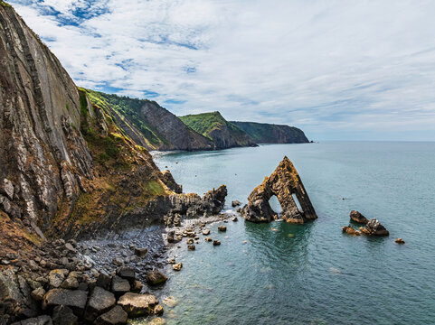 Blackchurch Rock and Cliffs over Mouthmill Beach from a drone, North Devon Coast, Devon, England
