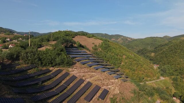 Aerial Flyover of Solar Panel Farm on Hillside Near Zenica