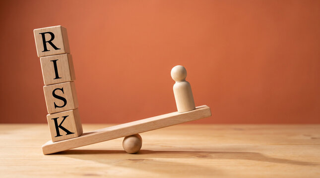 Unequal business risk distribution with heavy blocks outweighing a single wooden figure representing corporate vulnerability