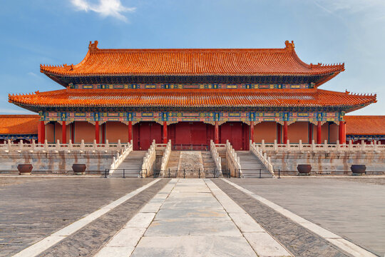 Beijing, China, massive imperial hall in Beijing's Forbidden City featuring orange tiled roofs, ornate painted beams, marble stairways and a vast stone courtyard