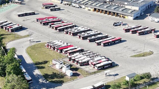 Urban public transit hub with parked commuter buses