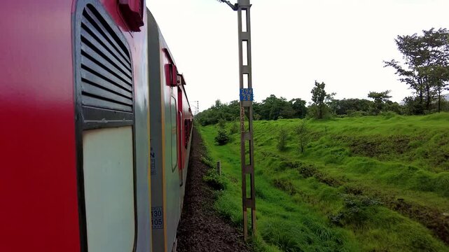 Side View from Passenger Train Traveling Through Konkan
