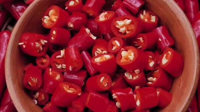 Sliced fresh red chili peppers in a basket