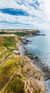 Panorama of Cliffs and Fields over Welcombe Mouth Beach from a drone, North Devon and Cornwall Coastpath Border, Devon, England, Summer 2026