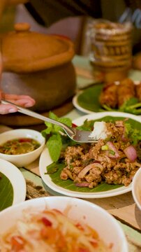 Person Eating Traditional Thai Isan Larb Moo Minced Pork Salad
