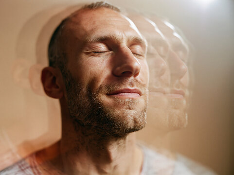 Peaceful Man Meditating with Multiple Exposure Effect