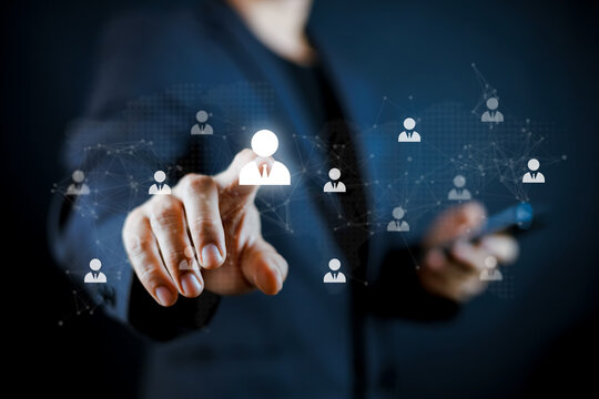 Businessman touching virtual screen with human resources network interface and team structure. Concept of talent management, networking, human resources, and corporate team building.