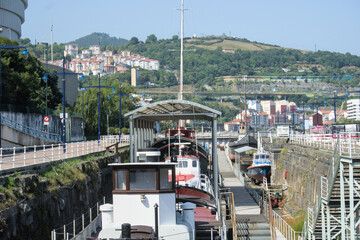 Bilbao, Spain - August 12, 2026: Preserved vessels in a former dry dock of the maritime museum © Ekaterina