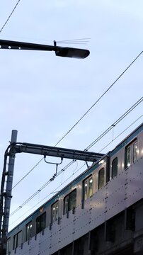 Commuter Train Passing on Elevated Track in Tokyo