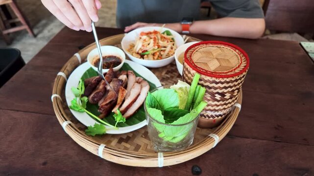 Traditional Thai Som Tum Papaya Salad and Grilled Pork Meal