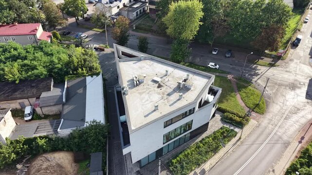 Top down drone view of modern building rooftop HVAC units