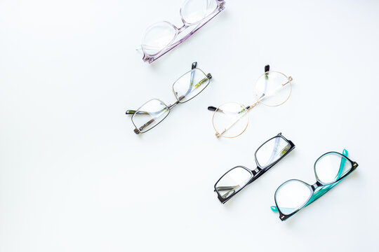 Glasses for vision on a white background in optical store. Vision test concept, stylish glasses concept