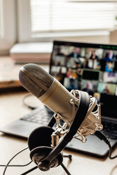 Microphone on the air and headphones for video conference calling on laptop computer