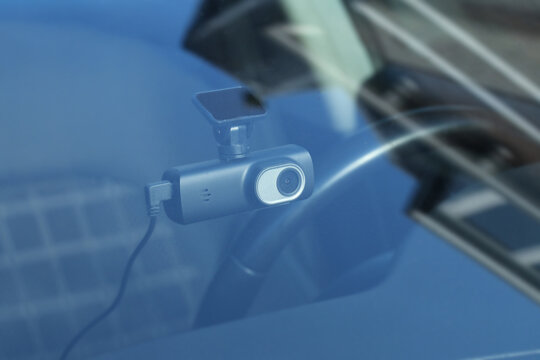 Dashcam safety camera dashboard car front view. Recording road for incients, accidents and traffic surveillance.