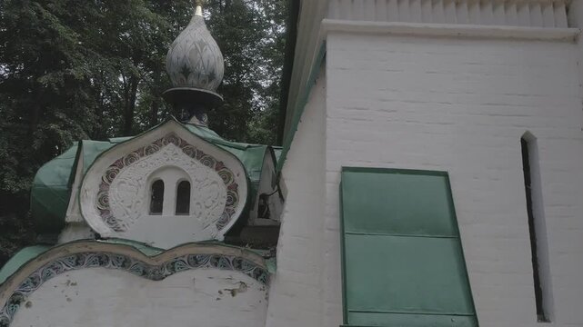 Drone rises closely along bell tower wall, D-Log