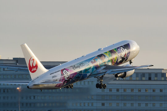 Japan Airlines Boeing 767-300ER (JA615J) passenger plane in Disney100 Dream Express livery taking off from Haneda Airport