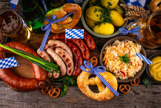 Oktoberfest food: beer brezel sausages cabbage potato and chicken