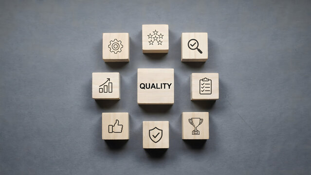 Wooden blocks with quality icons arranged in a circular pattern