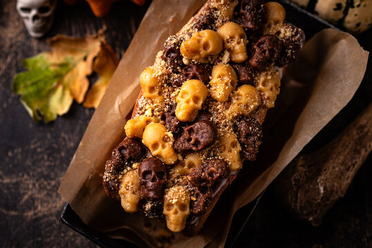 Halloween pumpkin cake decorated with skull
