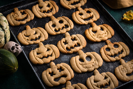Halloween pumpkin cookies in shape of jack-o-lantern