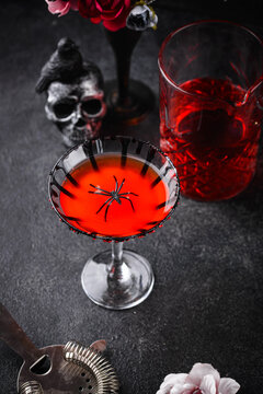 Spooky red Halloween martini cocktail with spider