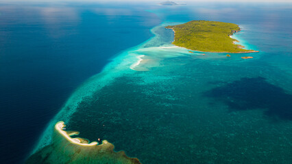 Aerial View of Tropical Island, Turquoise Lagoon and Stunning Coral Reef © Syamz