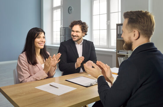 Recruiters applaud candidate after interview hiring approval. Managers and hr team greet an applicant, indicating hiring decision, job offer and agreement. Clear concept of winning recruitment.