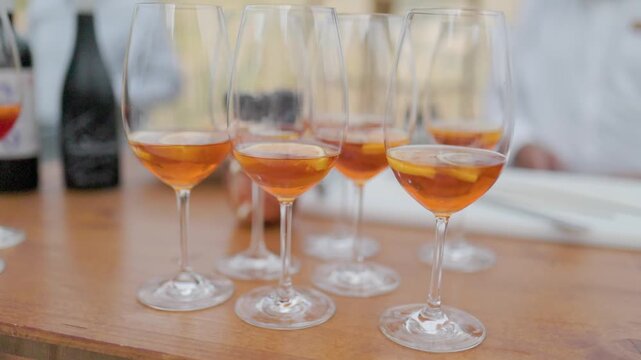 Aperitif cocktails with orange slices in glasses