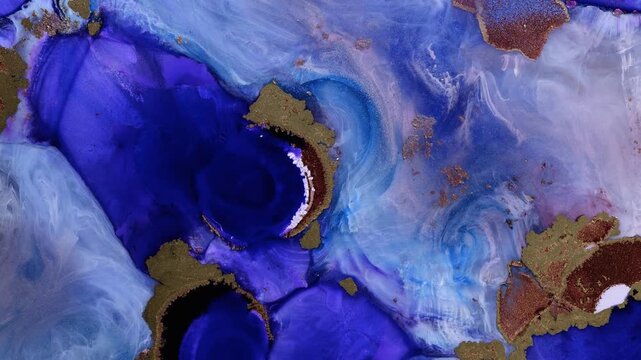 Mixing different colored alcohol inks and epoxy resin in a close-up view