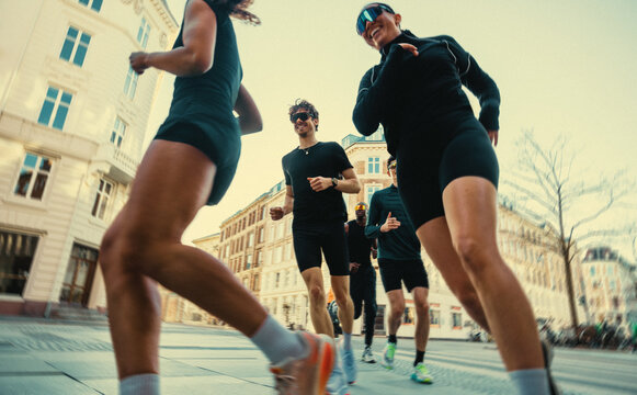 Pace defines the running group as it moves through the city with urban support