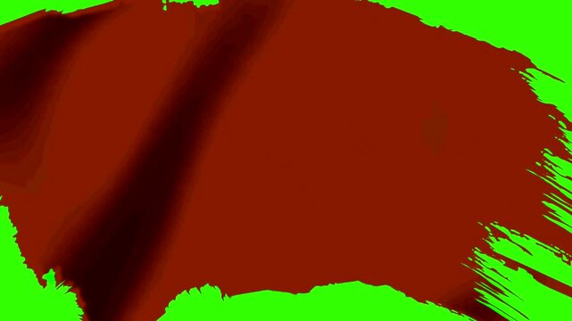Abstract dark red paint brush stroke isolated on green background