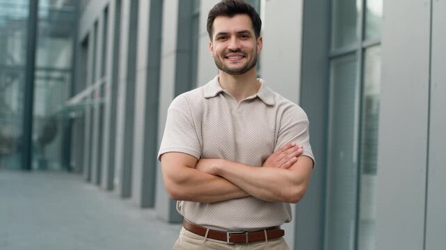 Happy Caucasian business man smiling cheerful posing with crossed hands in city businessman male guy executive smile crossing arms confident looking at camera optimistic specialist outdoor in downtown